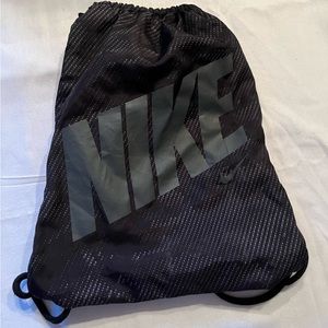2 Nike drawstring bags. Pretty worn but no holes, just some scuff marks.